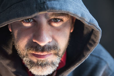 Portrait of man wearing hooded jacket