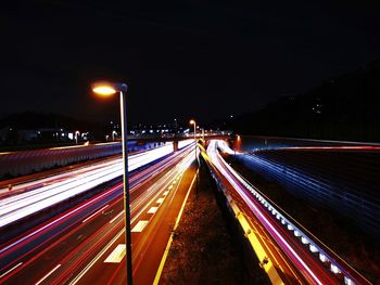 High angle view of light trails on road at night