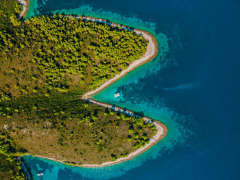 Sailing yacht catamaran anchored in a remote beautiful bay in croatia.