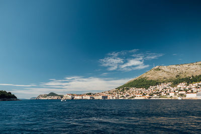 Scenic view of sea against blue sky