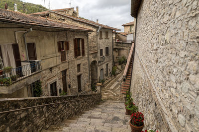 Street amidst buildings against sky