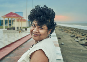 An indian girl enjoying early morning beauty of seascape at shankarpur, digha in west bengal.