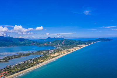 Panoramic view of sea and bay against blue sky