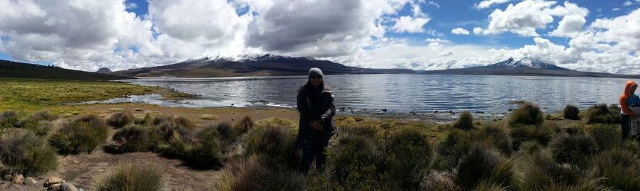 Scenic view of lake against cloudy sky