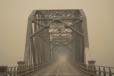 Bridge against sky during foggy weather