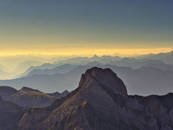 Scenic view of mountains against sky during sunrise 