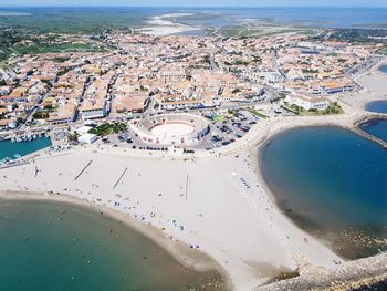 Aerial view of beach and buildings in city