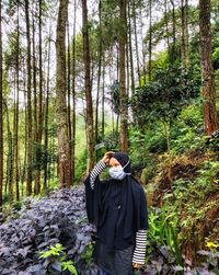 Man standing in forest