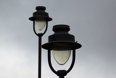 Low angle view of street light against clear sky during sunset