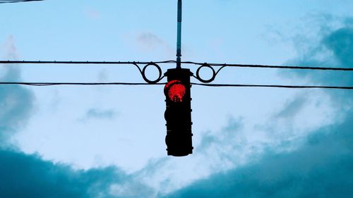 Low angle view of hanging against sky