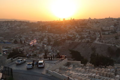 High angle shot of townscape against sky at sunset