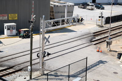 High angle view of vehicles on road along buildings