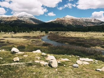 Scenic view of mountains against cloudy sky