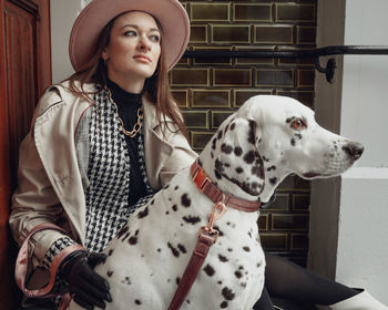 Portrait of young woman with dog