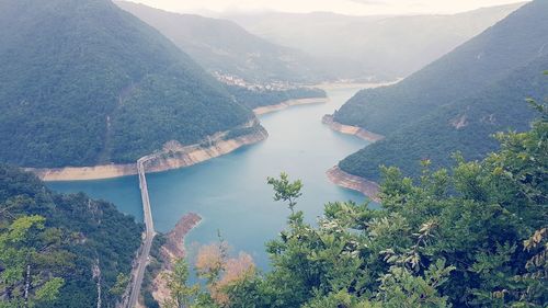 High angle view of river amidst mountains