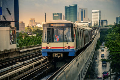 Train on railroad tracks in city