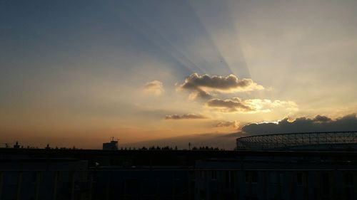 Silhouette building against sky during sunset