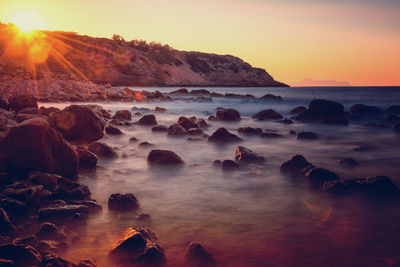 Scenic view of sea against sky during sunset