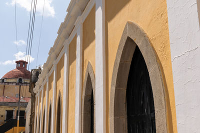 Low angle view of buildings against sky in city