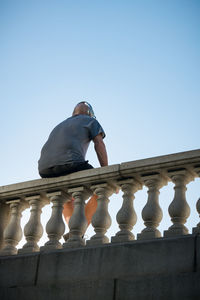 Low angle view of statue against clear blue sky