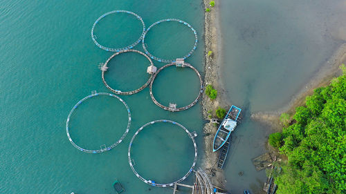 Fishing industry. fish farming on an industrial scale. large scale traditional floating fish farms.