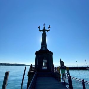 Statue of liberty against blue sky