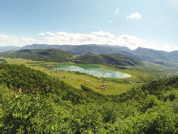 Scenic view of mountains against cloudy sky