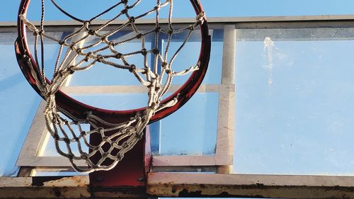Low angle view of basketball hoop against sky