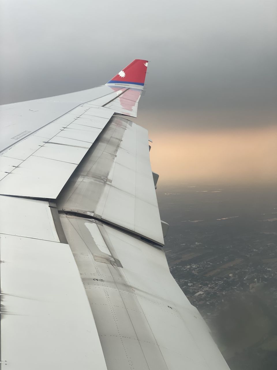 wing, airplane, aviation, aircraft, vehicle, transportation, sky, nature, no people, air vehicle, travel, mode of transportation, airliner, aircraft wing, outdoors, flying, white, day, environment, architecture, low angle view