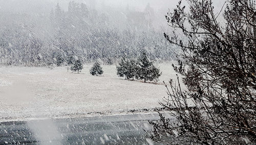 Close-up of waterdrops on water against sky