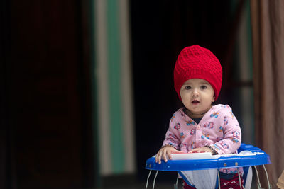 Portrait of cute baby in stroller
