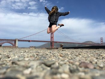 Low angle view of golden gate bridge against sky