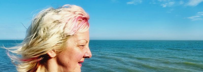 Mature woman looking at sea