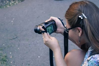 Cropped image of photographer photographing