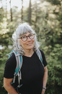 Senior woman hiking in forest