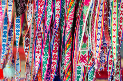 Close-up of colorful fabrics for sale at market stall