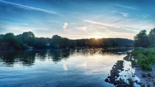 Scenic view of lake against sky during sunset