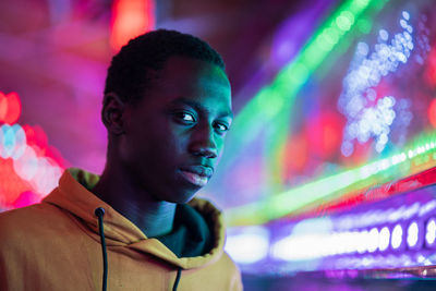 Portrait of a young man in amusement park