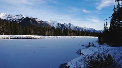 Scenic view of snowcapped mountains against sky during winter