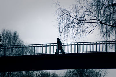 People walking on bridge