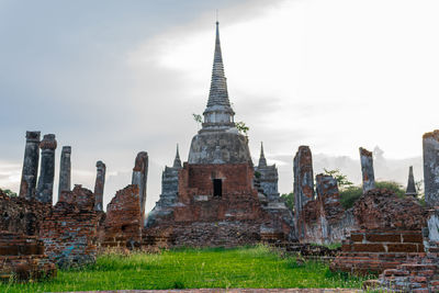 Panoramic view of temple against buildings