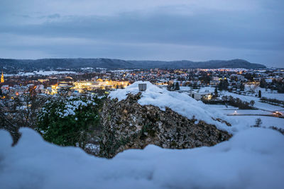 Aerial view of buildings in city during winter