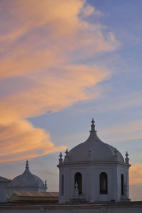 Church against sky during sunset