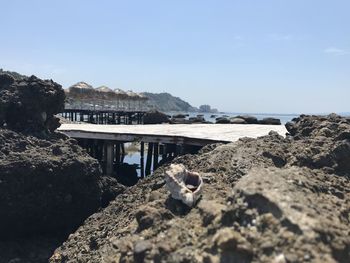 Scenic view of beach against clear sky
