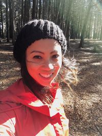 Portrait of smiling woman in forest