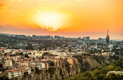 High angle view of buildings against sky during sunset