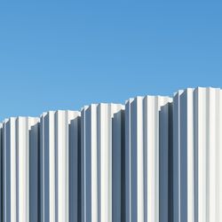 Concrete shape building with shadows on sky background. minimal architecture ideas concept. 