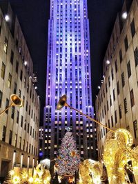 Low angle view of illuminated building at night