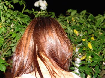 Rear view of woman with hair leaf
