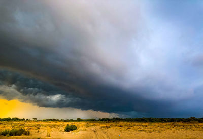 Scenic view of dramatic sky over land